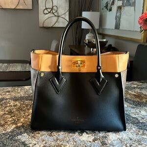 Louis Vuitton On My Side MM and coordinating Sarah Wallet.